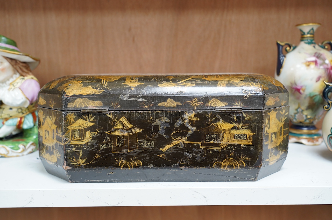 A 19th century Chinese lacquered sewing box, 33.5cm wide. Condition - fair, generally worn